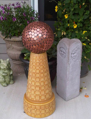 How to make a penny bowling ball, fun and unique yard art for your garden. And some people say the copper pennies repel slugs!