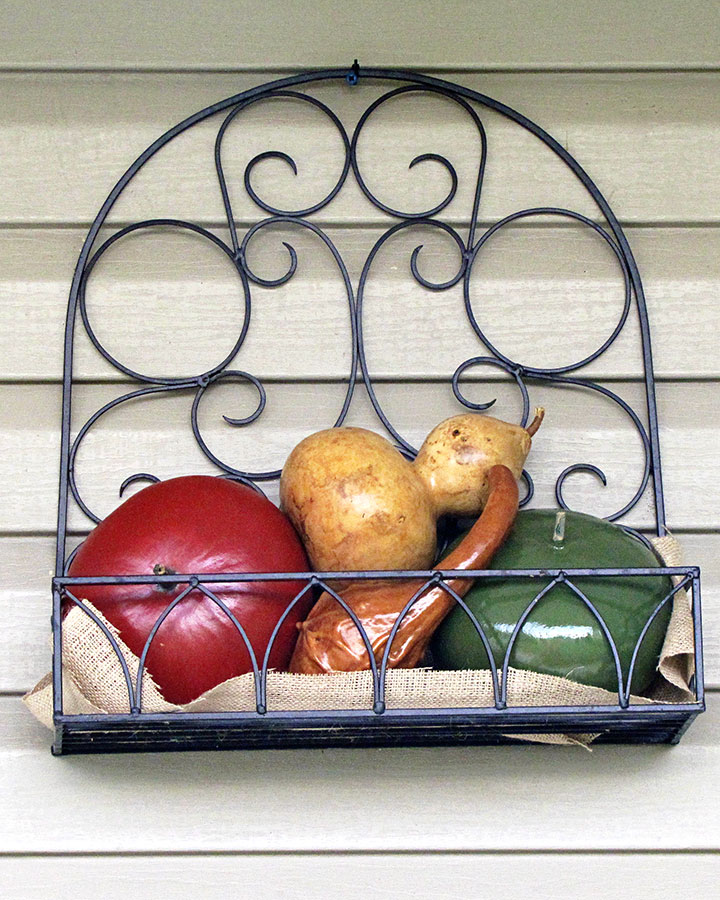 Painted gourds used as fall porch decor.