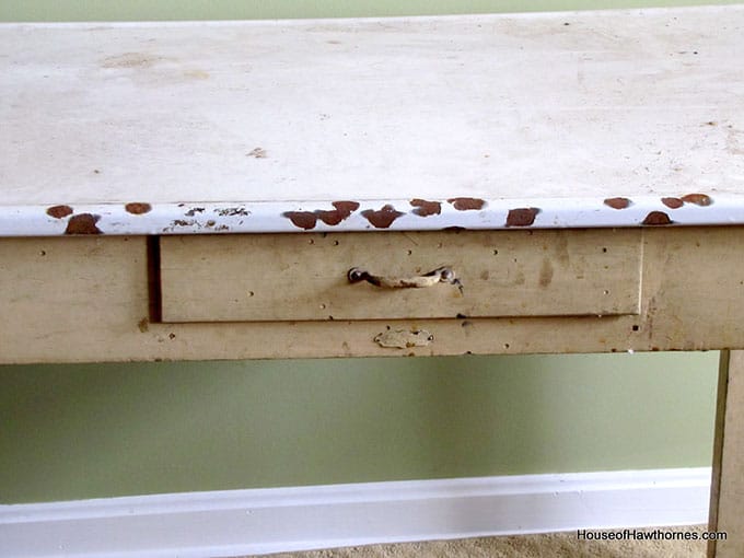 A vintage enamel topped baking table used for rolling out pie crust and cutting out biscuits and cookies.  A workhorse of the 20th century kitchen!  