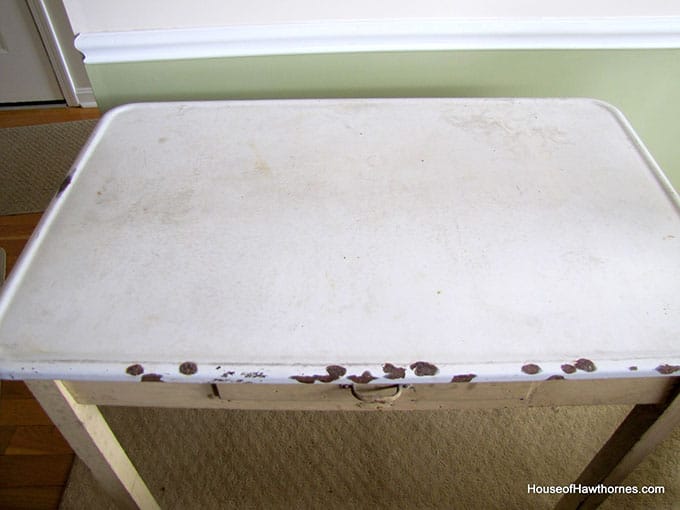 A vintage enamel topped baking table used for rolling out pie crust and cutting out biscuits and cookies.  A workhorse of the 20th century kitchen!  