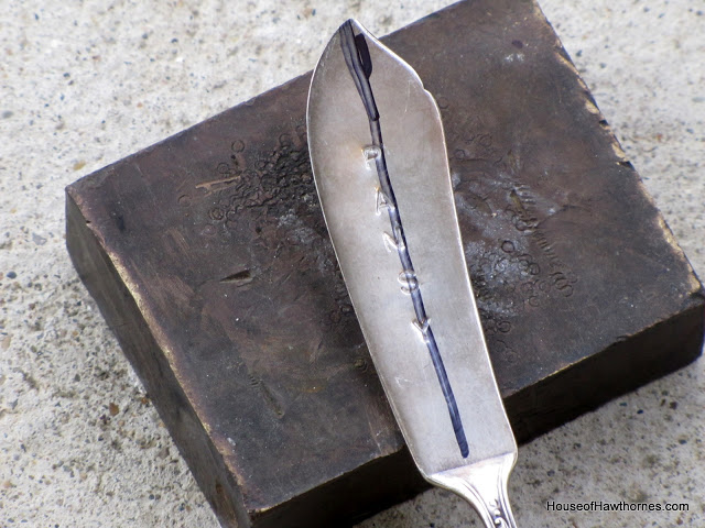 aligning letters on stamped silverware