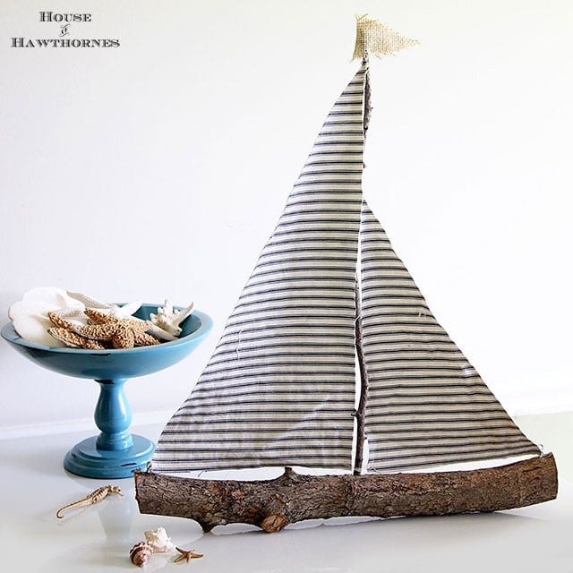 Sailboat made from twigs and scrap fabric.