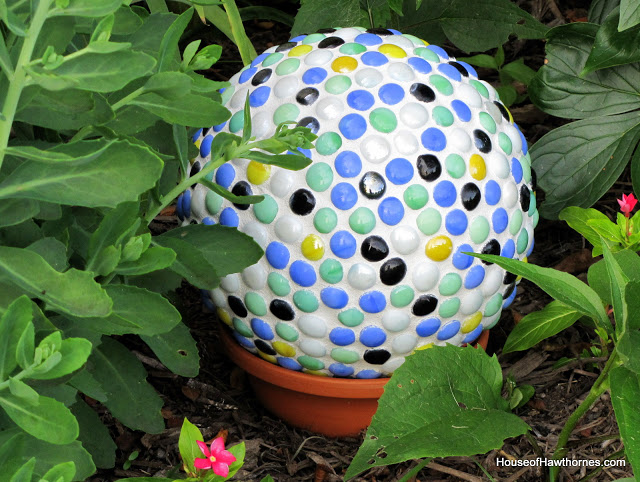 DIY fun yard art for your garden made from a bowling ball from houseofhawthornes.com