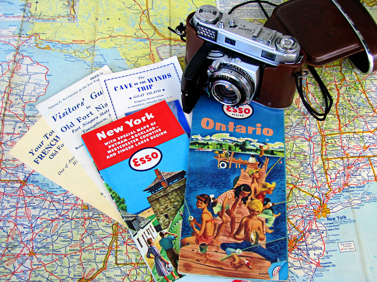 image of vintage travel maps and vintage camera