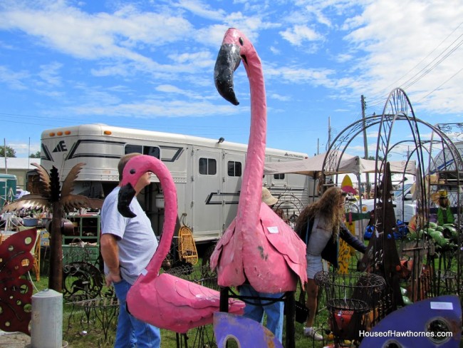 Metal pink flamingo sculptures.