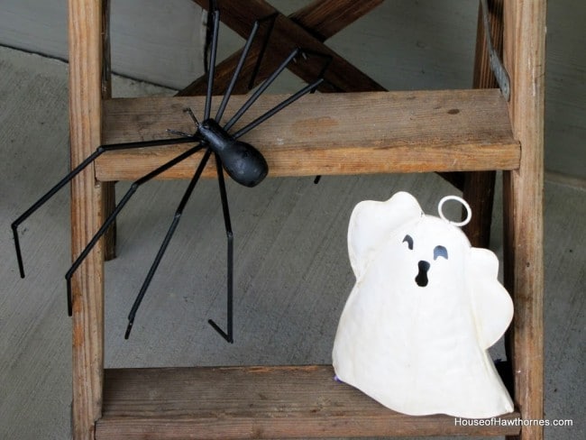 Ghost and spider on a step ladder for Halloween decor. 