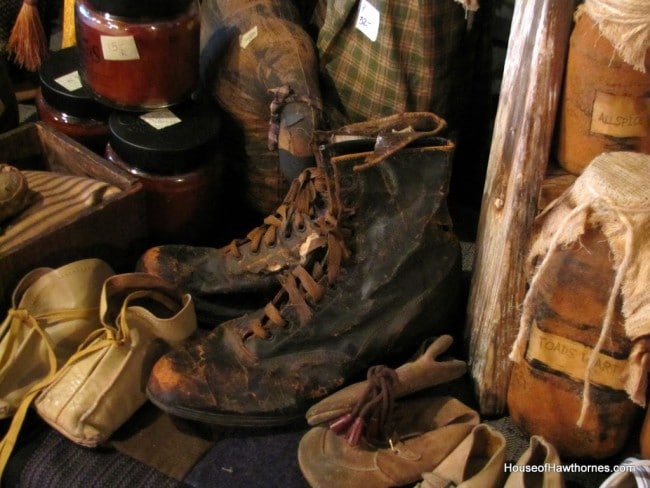 Old boots for sale at a antique fair.