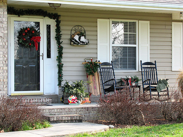 Festive DIY winter front porch decor including lots of vintage and thrift store decorating ideas. via houseofhawthornes.com