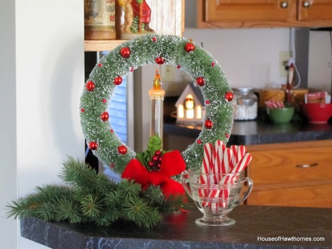Candle within a wreath as Christmas decor.