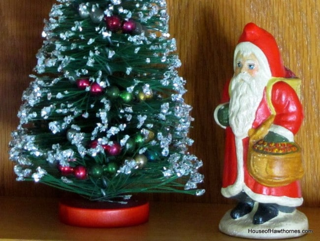 Vaillancourt chalkware Santa carrying a basket of apples.