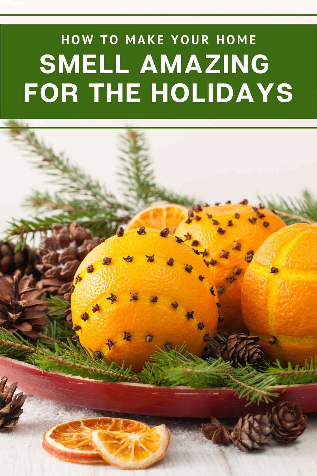 Orange clove pomander balls in a bowl.