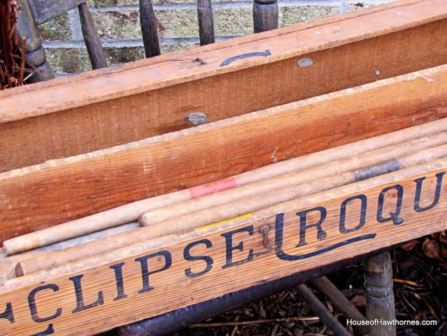 Sticks inside croquet box. 