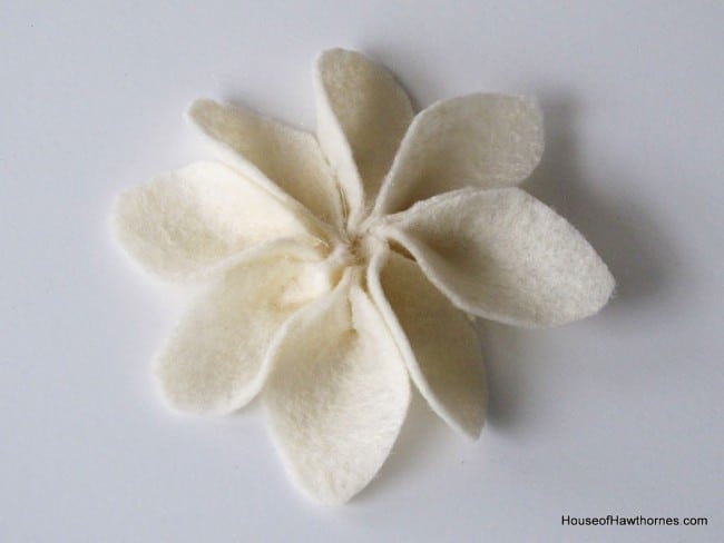 Combining petals to make a homemade craft flower.