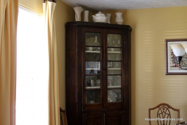 Corner cupboard with doors closed.