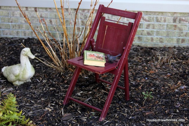 Red folding wooden chair.