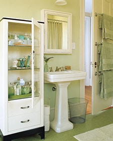 Vintage medical cabinet in a modern bathroom.