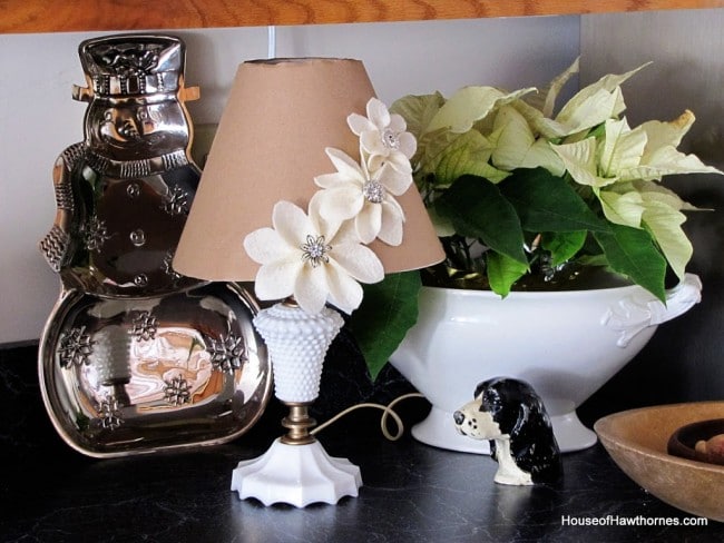 Lampshade cover using Kraft paper and felt flowers. 