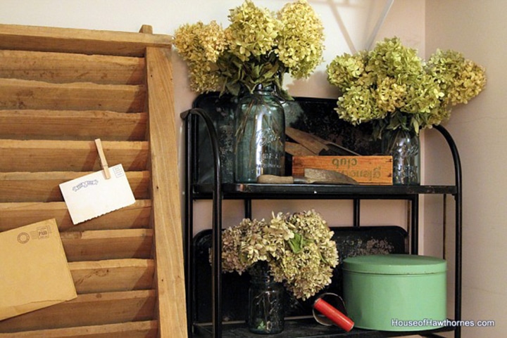 Black Versa Fold n Roll cart with hydrangeas setting on it.