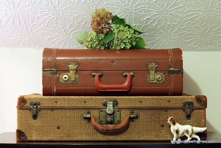 Vintage suitcases used as office storage.