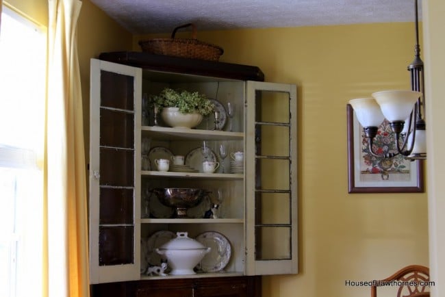 The inside of a vintage corner cabinet.