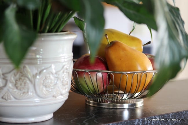 Fruit displayed in a silverplate bread bowl.