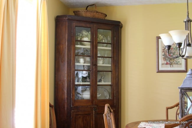 Antique wooden china corner cupboard.