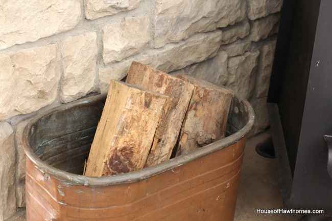 Copper tub used to hold firewood.