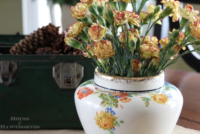 Vintage Harker Pottery vase with flowers on it.