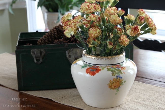 Vintage Harker Pottery vase with flowers on it.