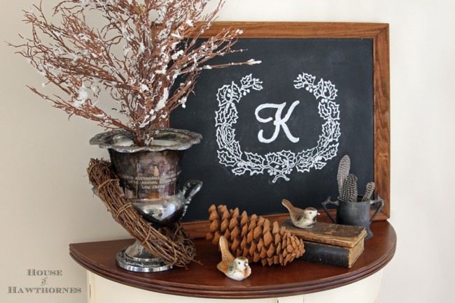 Bird themed vignette with silver champagne bucket, chalkboard and bird salt and pepper shakes. 