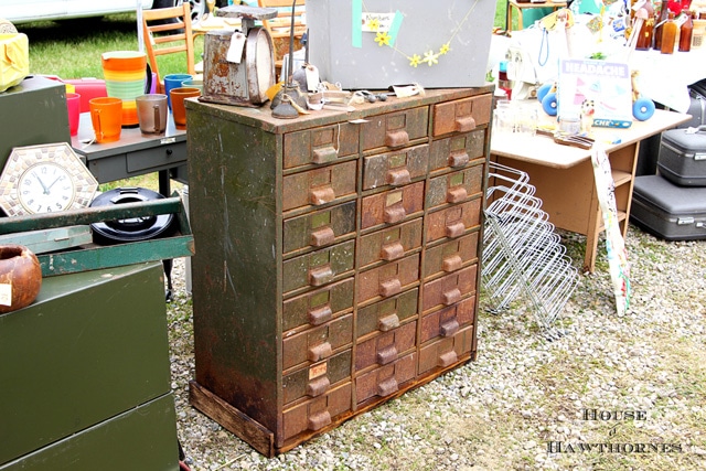 Rusty metal cabinet with many drawers.