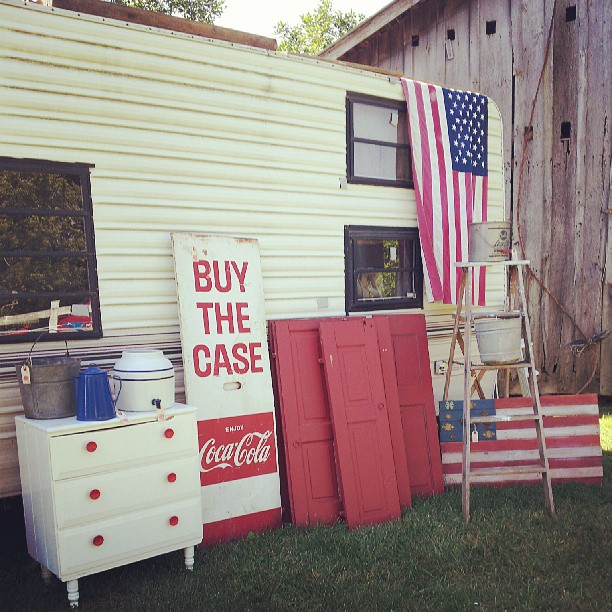Vintage Coca-cola sign and American flag.