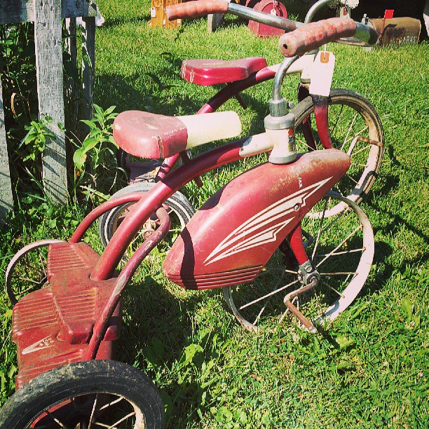 Vintage red tricycle.