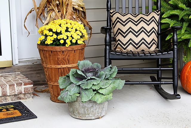 Fall porch decor with cornstalks, DIY wreath, and chevron pillows @ houseofhawthornes.com