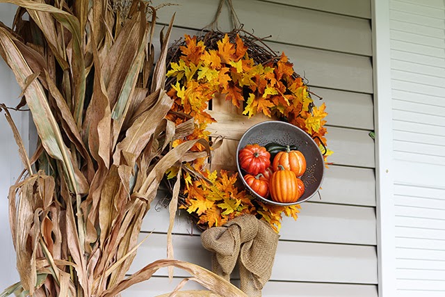 Fall porch decor with cornstalks, DIY wreath, and chevron pillows @ houseofhawthornes.com