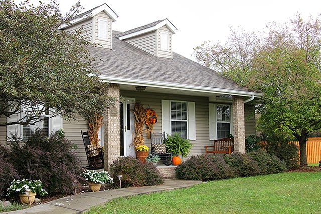 Fall porch decor with cornstalks, DIY wreath, and chevron pillows @ houseofhawthornes.com