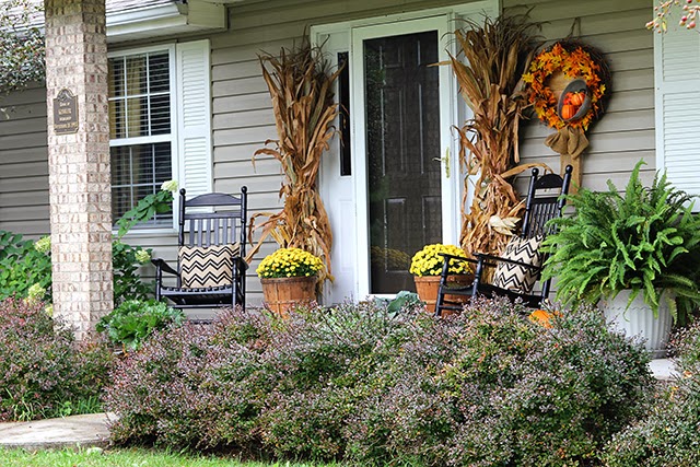 Fall porch decor with cornstalks, DIY wreath, and chevron pillows @ houseofhawthornes.com