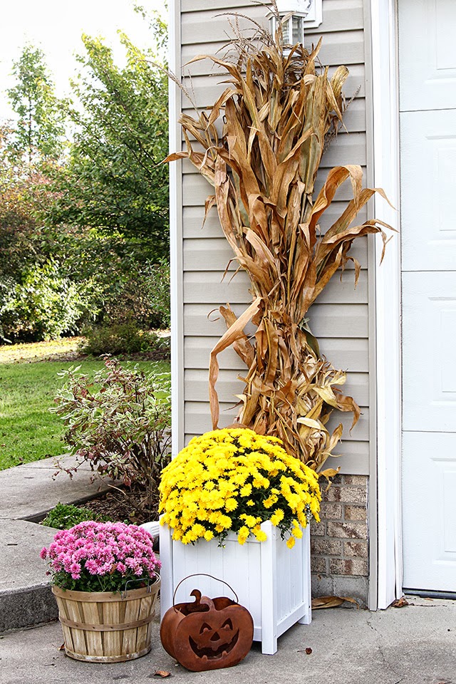 Fall porch decor with cornstalks, DIY wreath, and chevron pillows @ houseofhawthornes.com