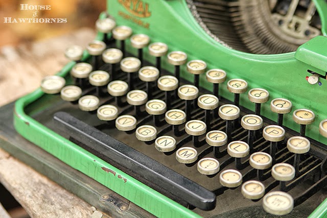 Closeup of the keys of a vintage green 1937 portable Royal typewriter.