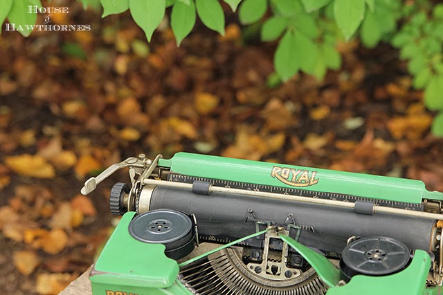 Closeup of the carriage of a vintage green 1937 portable Royal typewriter.