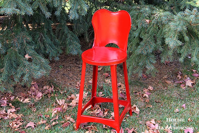 Vintage metal child's chair painted red for the holidays