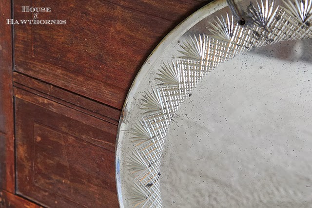 Round mirror with pretty etching around the perimeter found at an estate sale