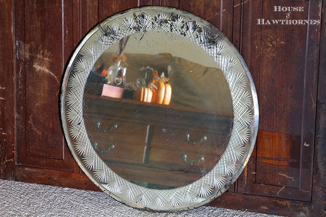 Round mirror with pretty etching around the perimeter found at an estate sale