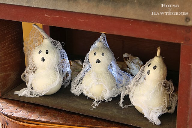 Halloween ghosts made from gourds, paint and cheesecloth @ houseofhawthornes.com