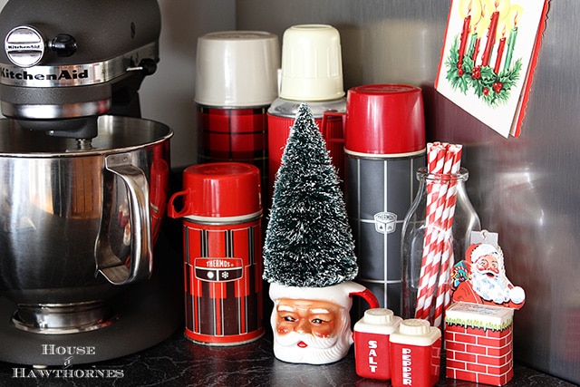 Thermos collection vignette for the holidays complete with Santa mug and a bottle brush tree
