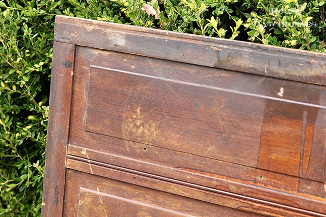 Cupboard door being painted in American Paint Company's chalk paint in Nana's Cupboard green