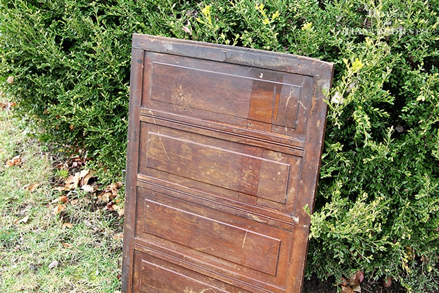 Cupboard door being painted in American Paint Company's chalk paint in Nana's Cupboard green