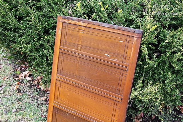 Cupboard door being painted in American Paint Company's chalk paint in Nana's Cupboard green