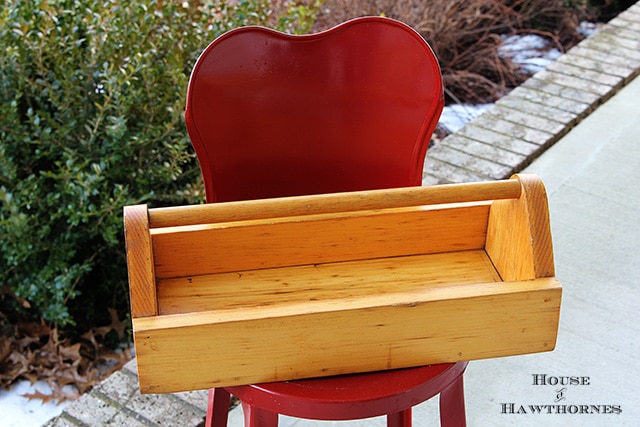 Wooden tool box being painted in Miss Mustard Seed's Milk Paint in Kitchen Scale blue