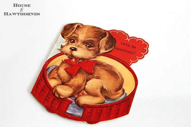 Vintage Valentine card with cute puppy in a bed